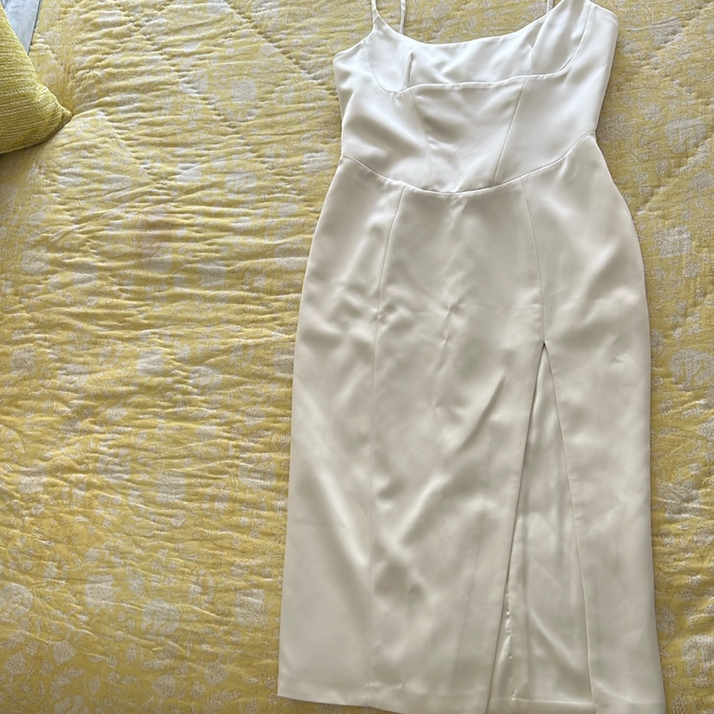 Chic White dress perfect for an engagement party.